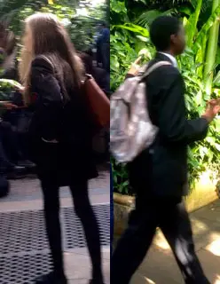 Schoolgirl and schoolboy in botanic house