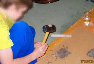 Boy playing with plastercine